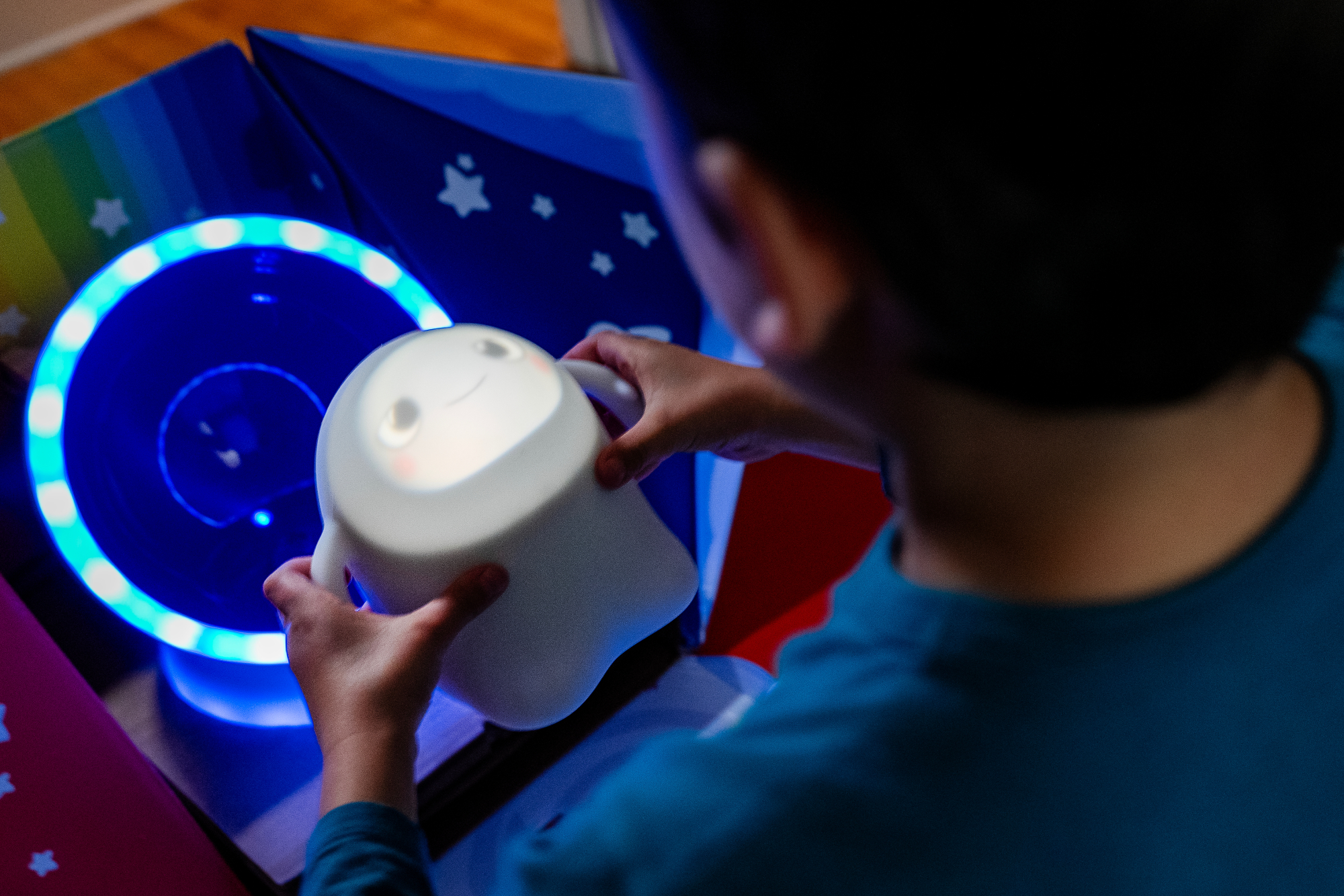 Child placing Snorble on dock